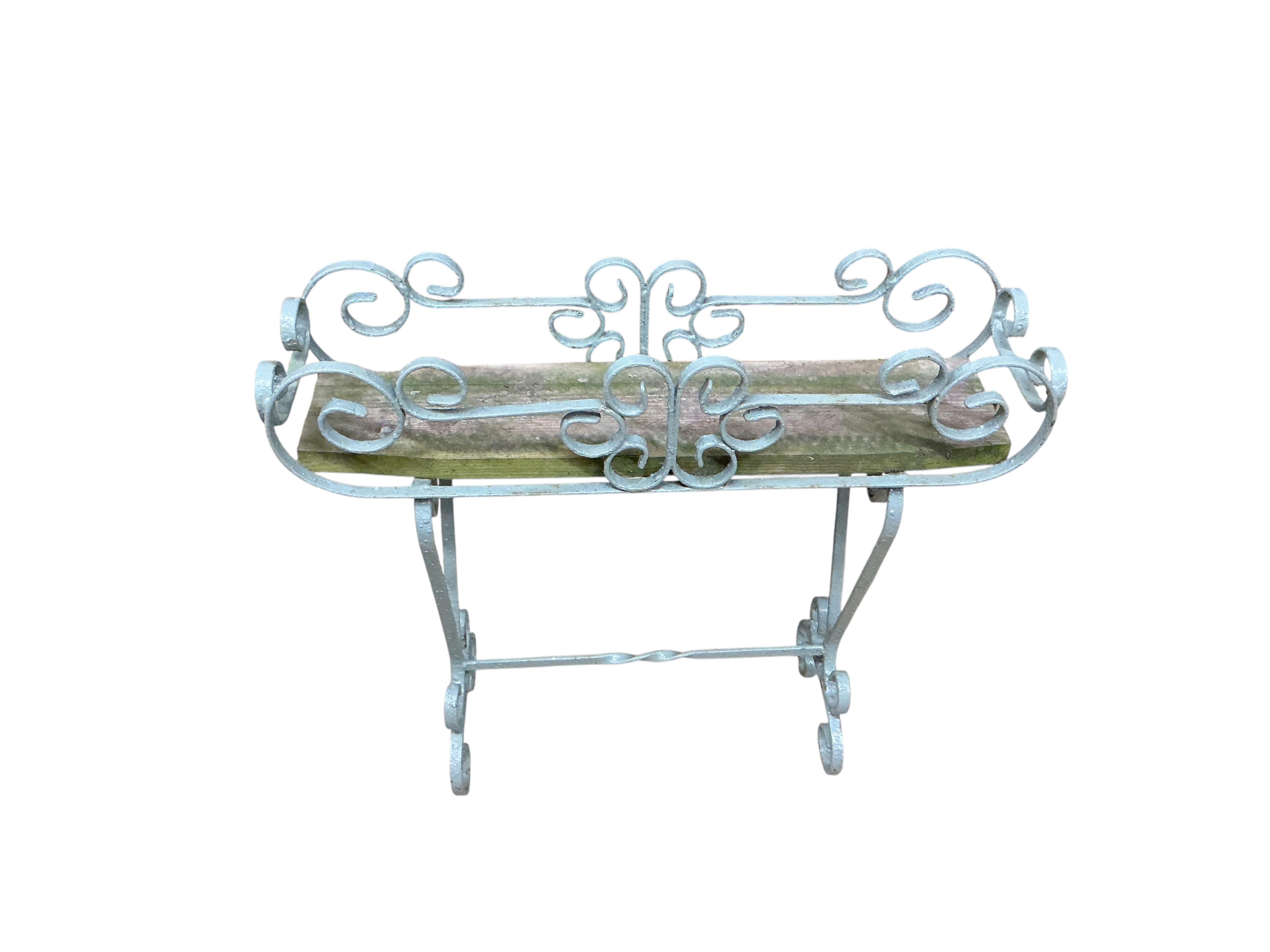 Three painted wrought pot stands, largest width 68cm, height 65cm